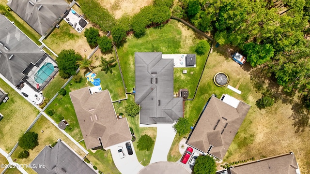 birds eye view of property with a residential view