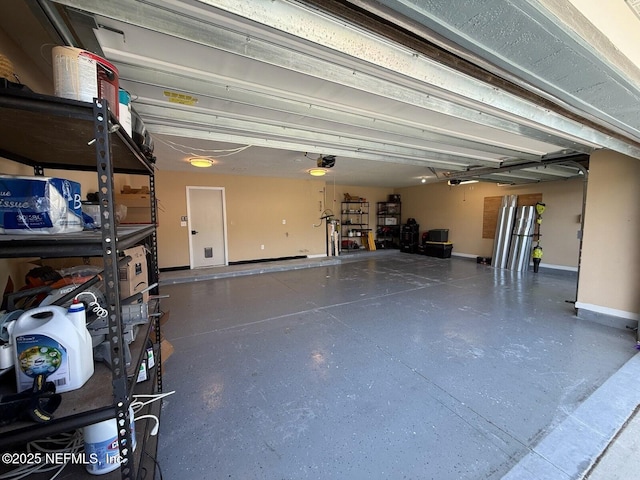 241 Peter Island Dr, Saint Augustine, FL 32092 - garage with baseboards and a garage door opener