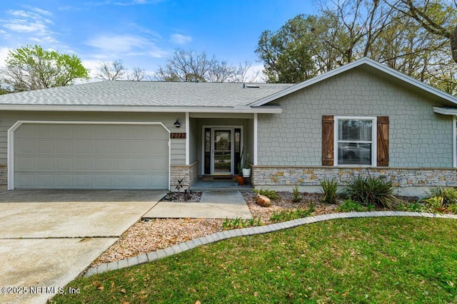 ranch-style house with an attached garage, stone siding, driveway, and roof with shingles