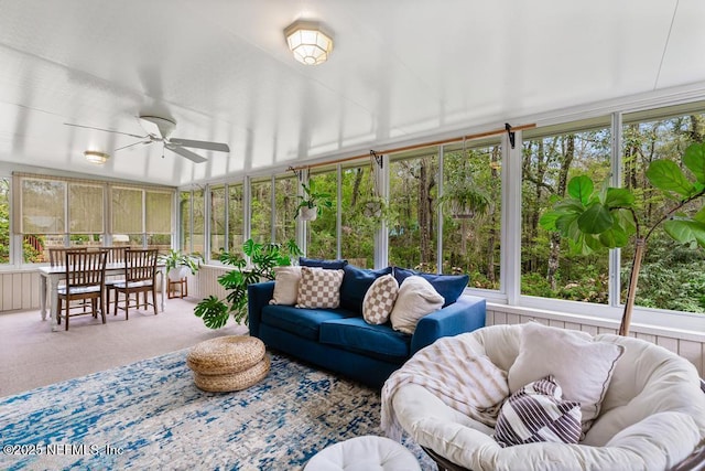 sunroom featuring a healthy amount of sunlight and ceiling fan