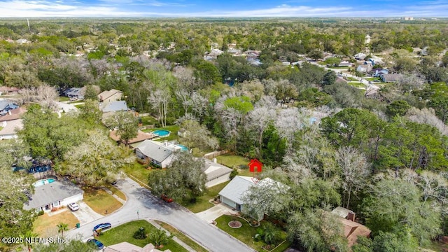 aerial view featuring a wooded view