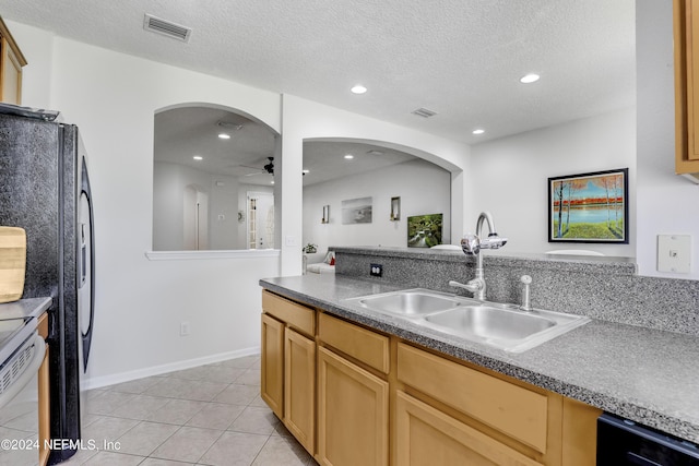 kitchen with recessed lighting, visible vents, a ceiling fan, light tile patterned flooring, and a sink