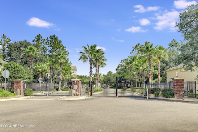 view of gate with fence