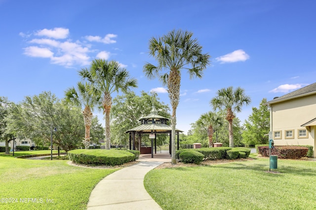 view of property's community featuring a yard and a gazebo