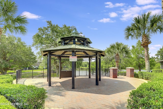 view of home's community featuring a gazebo and fence