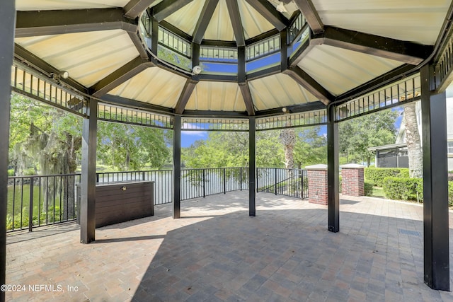 view of patio with a water view and a gazebo