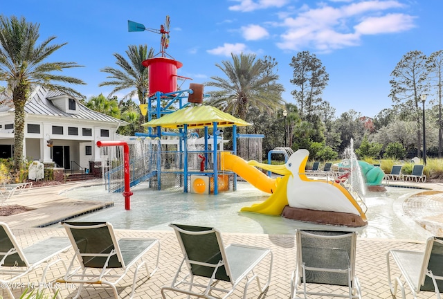 community play area featuring a patio area