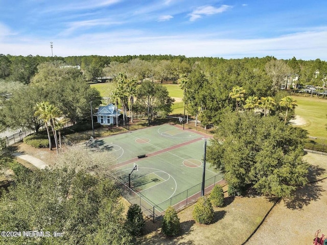 birds eye view of property featuring a wooded view