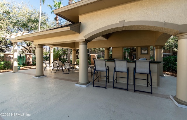 view of patio featuring outdoor dry bar