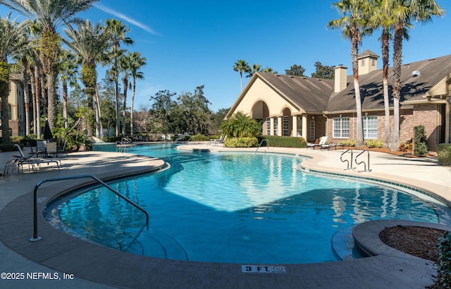 community pool with a patio