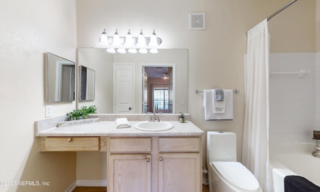 bathroom featuring toilet, shower / tub combo, vanity, and visible vents