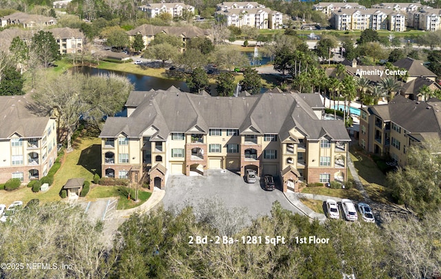 aerial view with a residential view and a water view