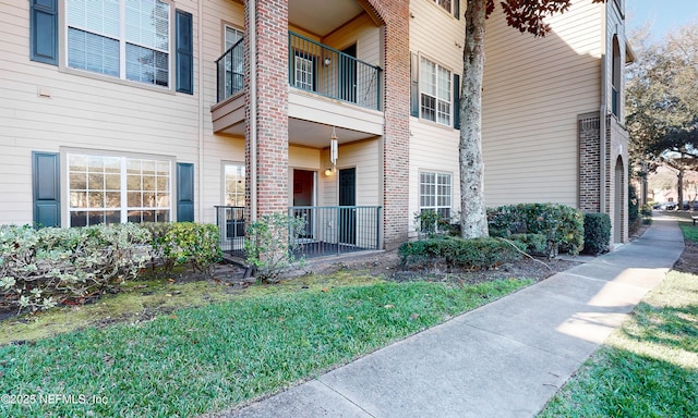 exterior space with brick siding