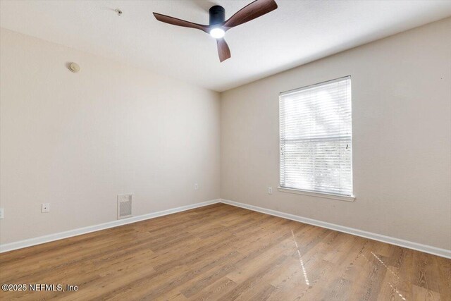 8539 Gate Pkwy W Unit 1723, Jacksonville, FL 32216 - unfurnished room featuring visible vents, baseboards, ceiling fan, and wood finished floors