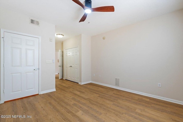 8539 Gate Pkwy W Unit 1723, Jacksonville, FL 32216 - unfurnished room featuring visible vents, baseboards, a ceiling fan, and wood finished floors