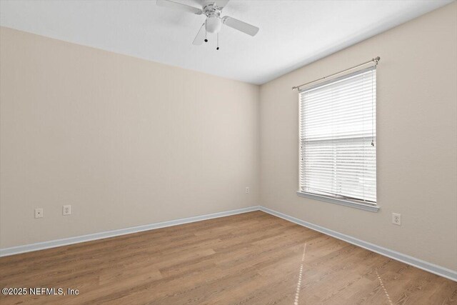 8539 Gate Pkwy W Unit 1723, Jacksonville, FL 32216 - unfurnished room featuring a ceiling fan, wood finished floors, and baseboards
