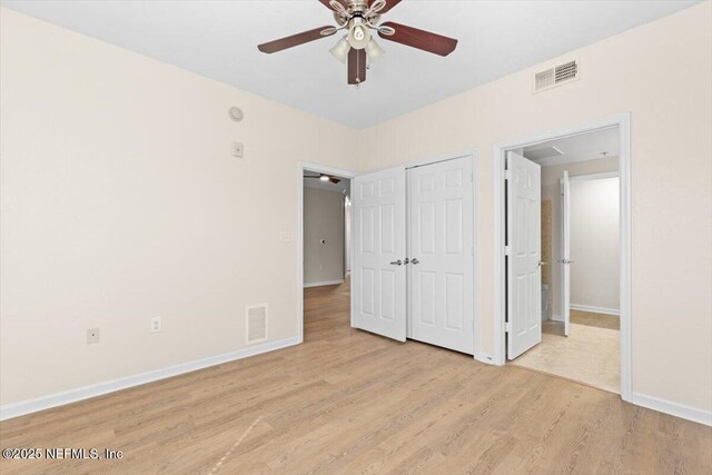 8539 Gate Pkwy W Unit 1723, Jacksonville, FL 32216 - unfurnished bedroom with baseboards, visible vents, a closet, and light wood-type flooring