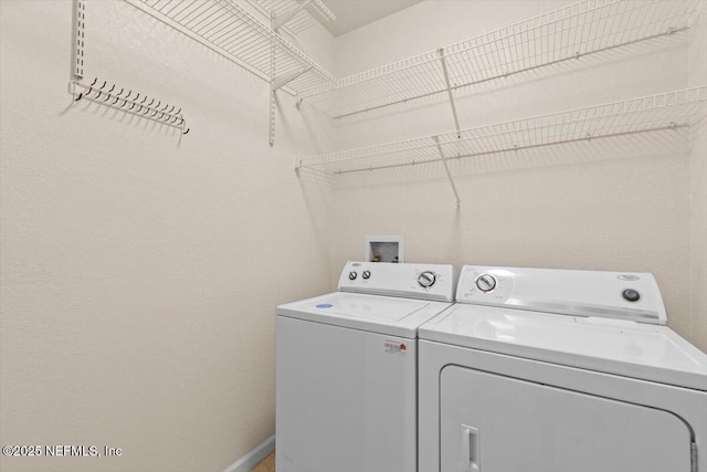 8539 Gate Pkwy W Unit 1723, Jacksonville, FL 32216 - clothes washing area featuring baseboards, laundry area, and washer and clothes dryer