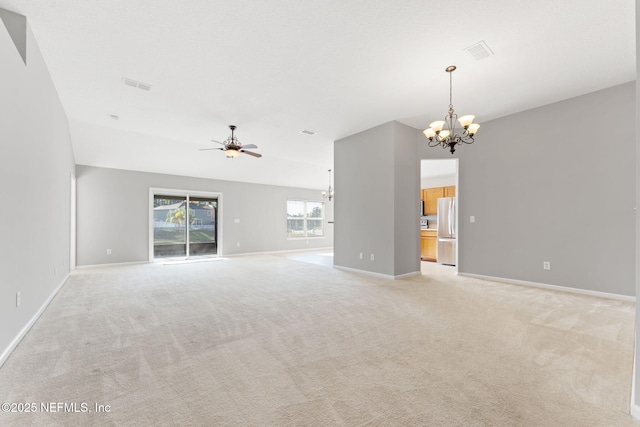 unfurnished living room featuring light carpet, visible vents, ceiling fan with notable chandelier, and baseboards