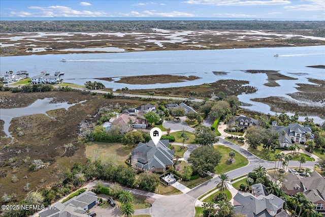 birds eye view of property featuring a residential view and a water view