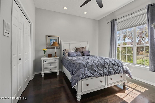 bedroom with a ceiling fan, wood finished floors, baseboards, recessed lighting, and a closet