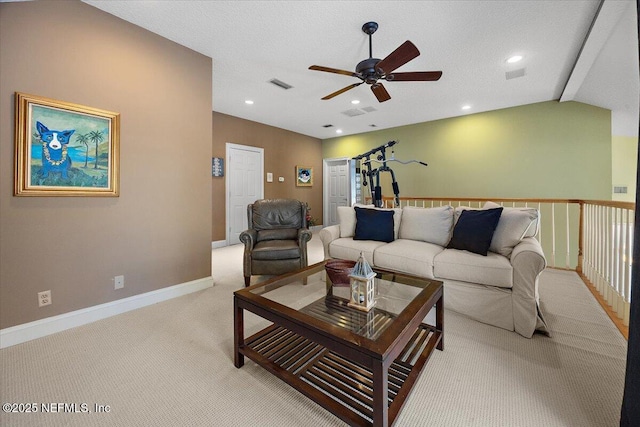 carpeted living area with recessed lighting, visible vents, baseboards, and a ceiling fan