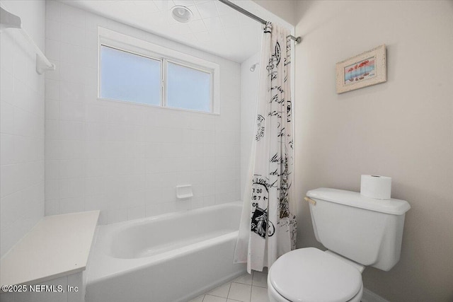 full bath featuring tile patterned floors, toilet, and shower / bath combination with curtain