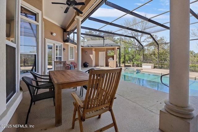 view of patio with outdoor dining space, a lanai, a ceiling fan, and a pool with connected hot tub