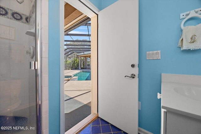 doorway featuring tile patterned floors and a sink