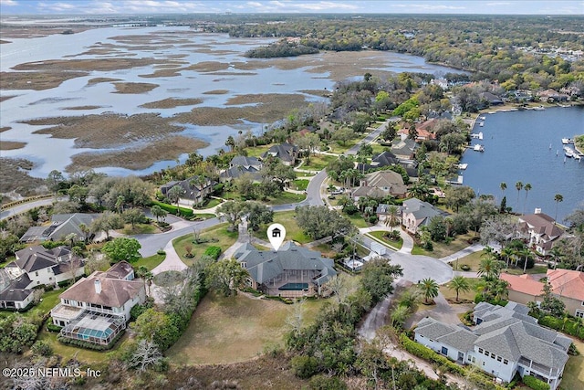 birds eye view of property with a residential view and a water view