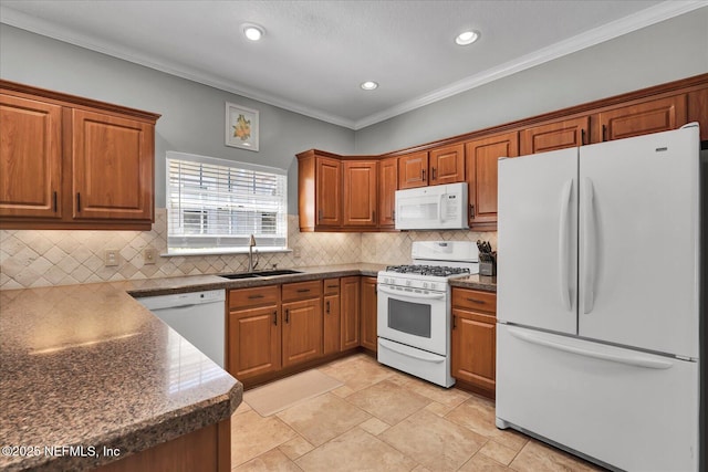 kitchen featuring backsplash, ornamental molding, brown cabinetry, white appliances, and a sink