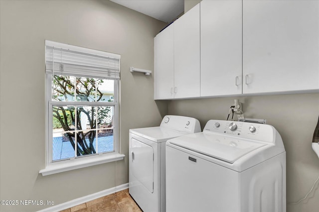 laundry area featuring cabinet space, baseboards, and separate washer and dryer