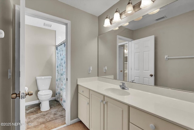 bathroom featuring visible vents, baseboards, toilet, and vanity