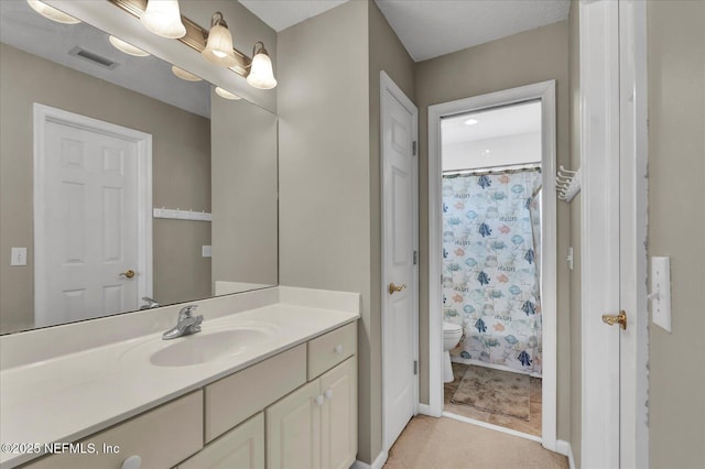 full bath with visible vents, toilet, vanity, and a shower with shower curtain