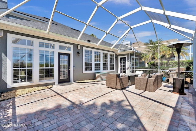 view of patio with outdoor lounge area and a lanai