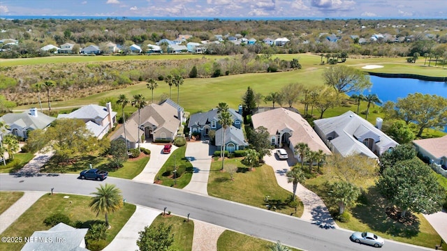 bird's eye view featuring a residential view and a water view