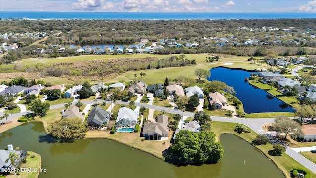 birds eye view of property with a residential view and a water view