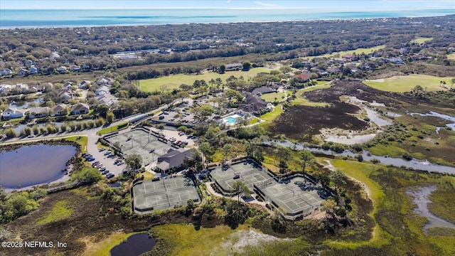 birds eye view of property featuring a water view and a residential view