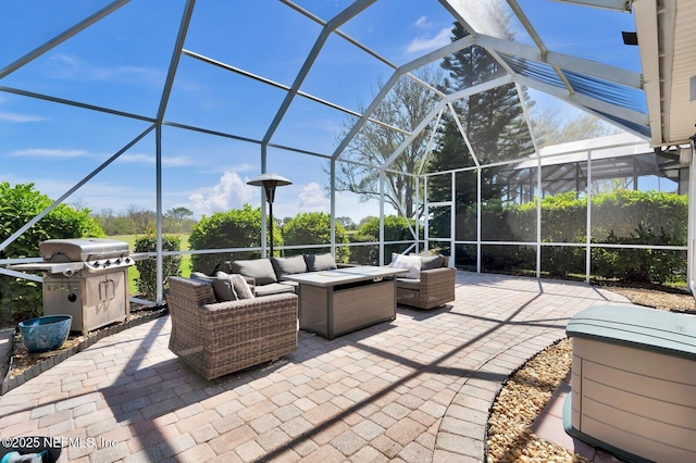 view of patio featuring area for grilling, glass enclosure, and an outdoor hangout area