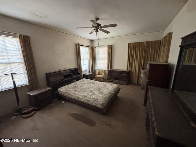 bedroom with ceiling fan and carpet floors