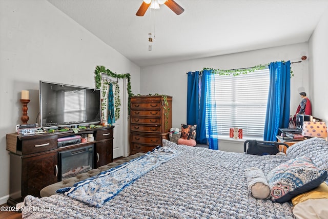 bedroom with lofted ceiling and ceiling fan