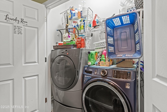 clothes washing area featuring laundry area and separate washer and dryer