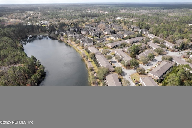 bird's eye view featuring a water view, a residential view, and a view of trees