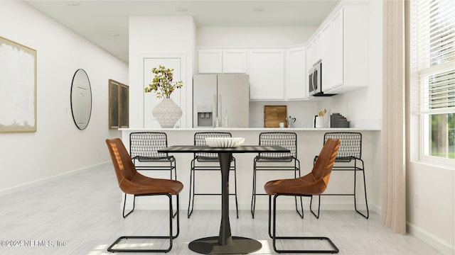 dining room featuring baseboards