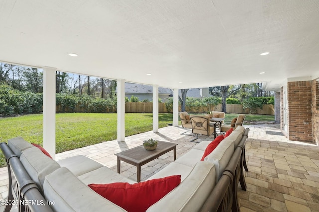 view of patio / terrace with an outdoor living space and a fenced backyard