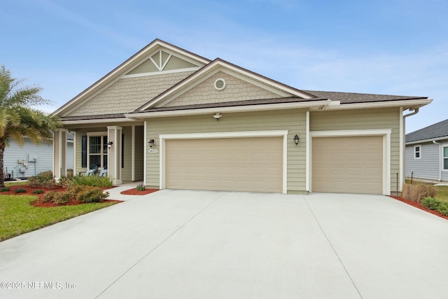 view of front of property with a garage and driveway