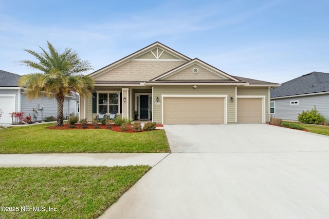 view of front of house featuring a garage, concrete driveway, and a front yard