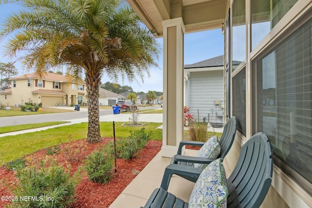 view of patio featuring a porch and a residential view