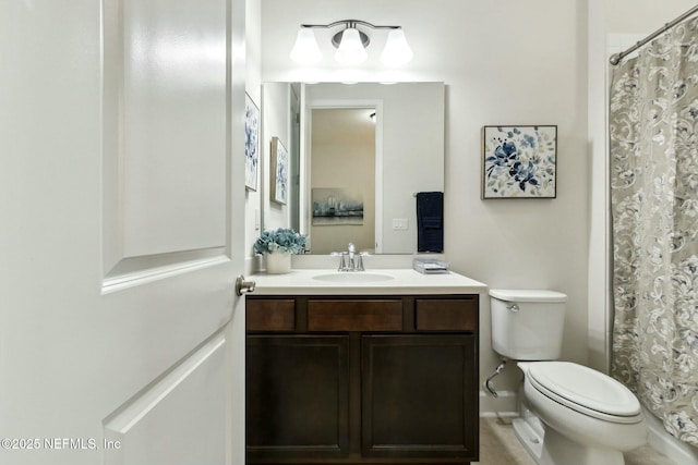 bathroom with vanity, toilet, and a shower with curtain