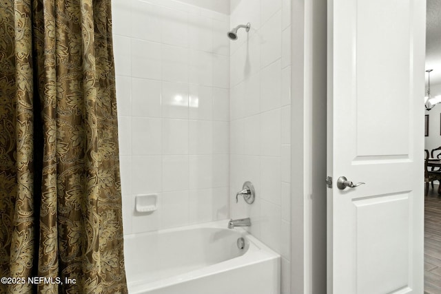 bathroom featuring shower / bath combination with curtain